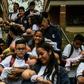 Students carry their "babies" during a break at a school in Caldas municipality, Colombia on May 17, 2019