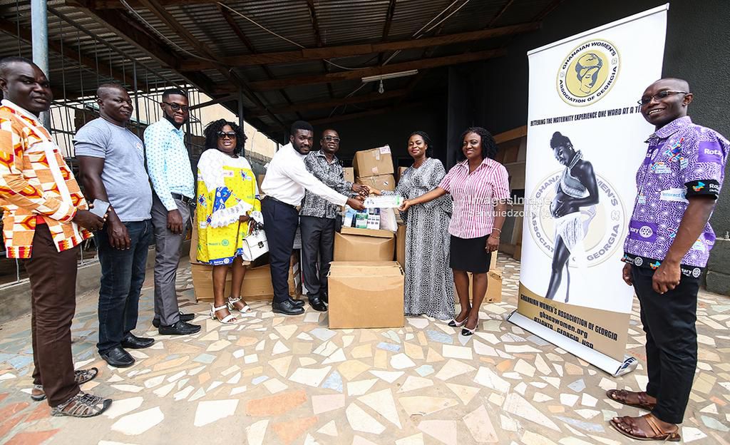 GWAG representatives (from right) Pearl Aglago and Mrs. Nayram Kyei-Mensah present the items to Mr. Mensah-Acheampong (3rd from right), as President of the Accra Airport City Rotary Club, Mr. Spencer Asamoah (4th from right) looks on.