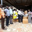 GWAG representatives (from right) Pearl Aglago and Mrs. Nayram Kyei-Mensah present the items to Mr. Mensah-Acheampong (3rd from right), as President of the Accra Airport City Rotary Club, Mr. Spencer Asamoah (4th from right) looks on.