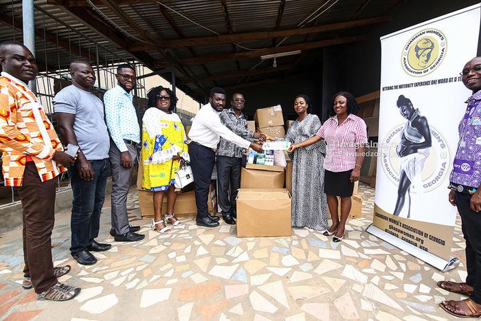 GWAG representatives (from right) Pearl Aglago and Mrs. Nayram Kyei-Mensah present the items to Mr. Mensah-Acheampong (3rd from right), as President of the Accra Airport City Rotary Club, Mr. Spencer Asamoah (4th from right) looks on.