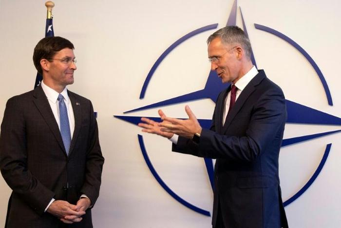 Acting US Secretary for Defense Mark Esper (l) greeted by NATO Secretary General Jens Stoltenberg in Brussels