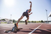 Runner on tartan track starting