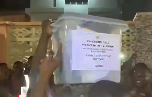Angry crowd assaults police officer for trying to smuggle unsealed ballot boxes.
