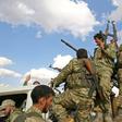 Turkish-backed Syrian rebel fighters are gathering near the Syrian-Turkish border in preparation for a Turkish offensive against Kurdish forces