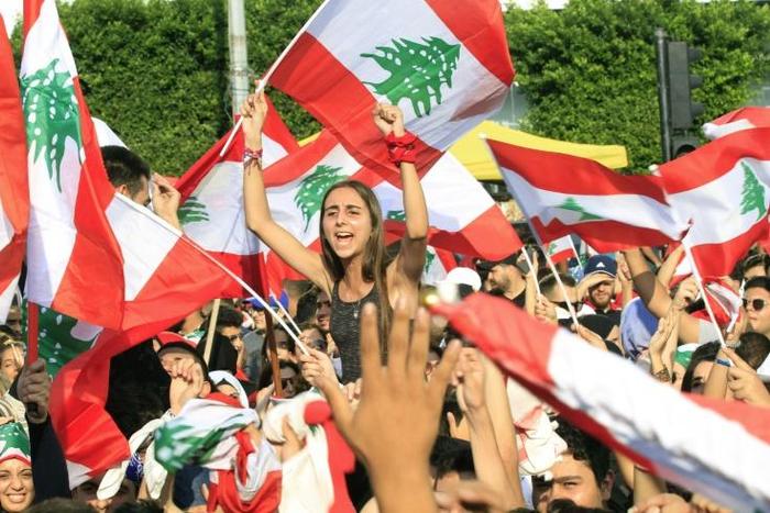Protests took place across Lebanon, with demonstrators waving Lebanese flags in the crowd in the southern city of Sidon