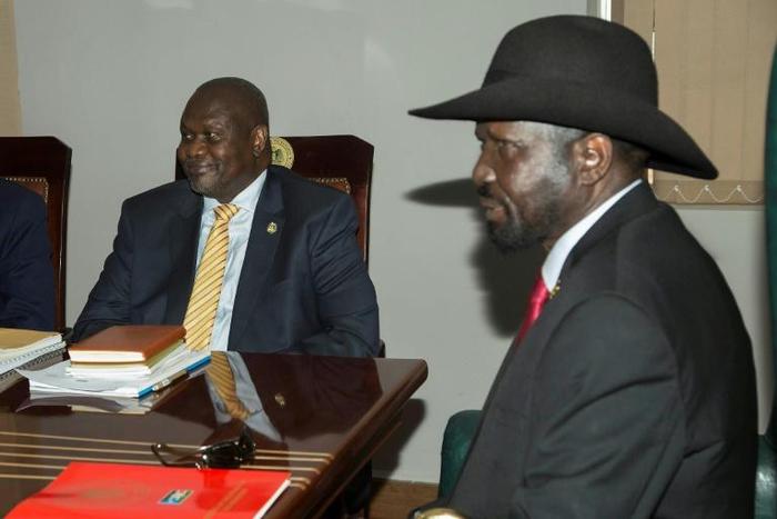South Sudan rebel leader Riek Machar, left, meets with President Salva Kiir in Juba to try and salvage a peace deal