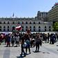 Demonstrators outside the Presidential Palace, known as La Moneda, in Santiago, Chile where President Sebastian Pinera shuffled his cabinet amid a crisis