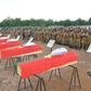 Burkina Faso soldiers in August 2018 pay their respects to soldiers killed when their vehicle struck a roadside bomb in the eastern part of the country