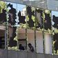 Workers repair damage to the offices of a pension fund after violent protests in Chile spread to the upmarket Santiago neighborhood of Providencia