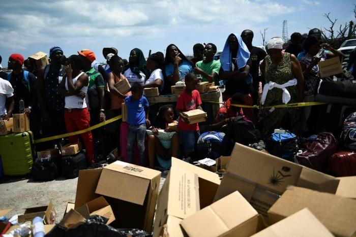 Bahamians waiting to be evacuated from the dock at Marsh Harbour, on the island of Abaco, which was devatsted by hurricane Dorian