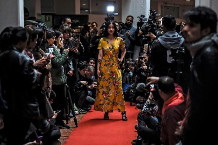 A model shows off a kimono during a fashion show by former FARC combatants in Bogota