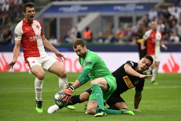 Slavia Prague goalkeeper Ondrej Kolar (centre) faces the might of Barca on Wednesday