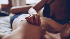 Couple cuddling in the bed