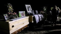 Relatives and friends stand next to coffins holding the remains of Rhonita Miller and four of her children, who were among the nine victims of an attack November 4, 2019, being blamed on a drug cartel in northern Mexico