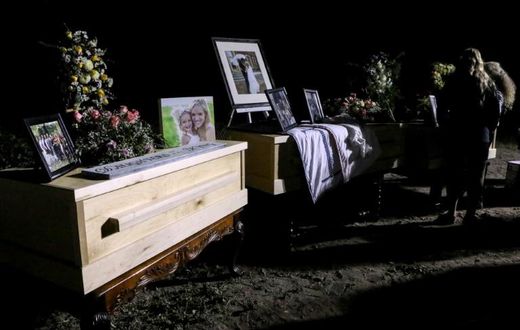 Relatives and friends stand next to coffins holding the remains of Rhonita Miller and four of her children, who were among the nine victims of an attack November 4, 2019, being blamed on a drug cartel in northern Mexico