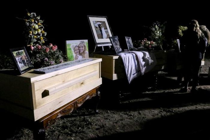 Relatives and friends stand next to coffins holding the remains of Rhonita Miller and four of her children, who were among the nine victims of an attack November 4, 2019, being blamed on a drug cartel in northern Mexico