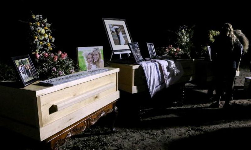 Relatives and friends stand next to coffins holding the remains of Rhonita Miller and four of her children, who were among the nine victims of an attack November 4, 2019, being blamed on a drug cartel in northern Mexico