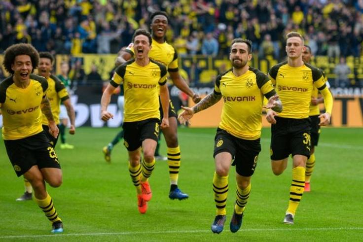 Spanish forward Paco Alcacer (second from right) was Borussia Dortmund's hero as they beat Wolfsburg to go back to the top of the Bundesliga