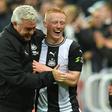 Newcastle manager Steve Bruce congratulates Matty Longstaff after the win against Manchester United