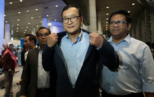 Cambodia's exiled opposition leader Sam Rainsy arrived in Malaysia after being barred in Paris from getting on a flight to Thailand