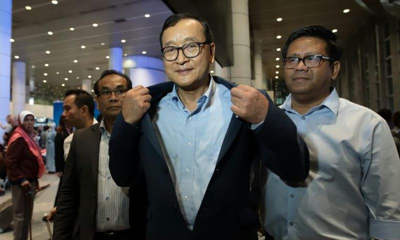 Cambodia's exiled opposition leader Sam Rainsy arrived in Malaysia after being barred in Paris from getting on a flight to Thailand