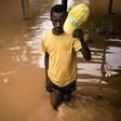 Fisherman Edouard walks among the flooded ruins of his house in Bangui. "I don't have the money to rebuild it," he said