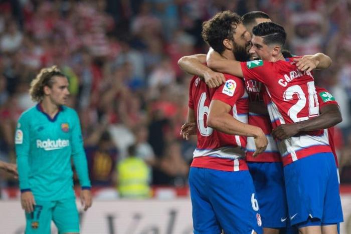 Granada players celebrate at the end of their stunning win over Antoine Griezmann and Barcelona