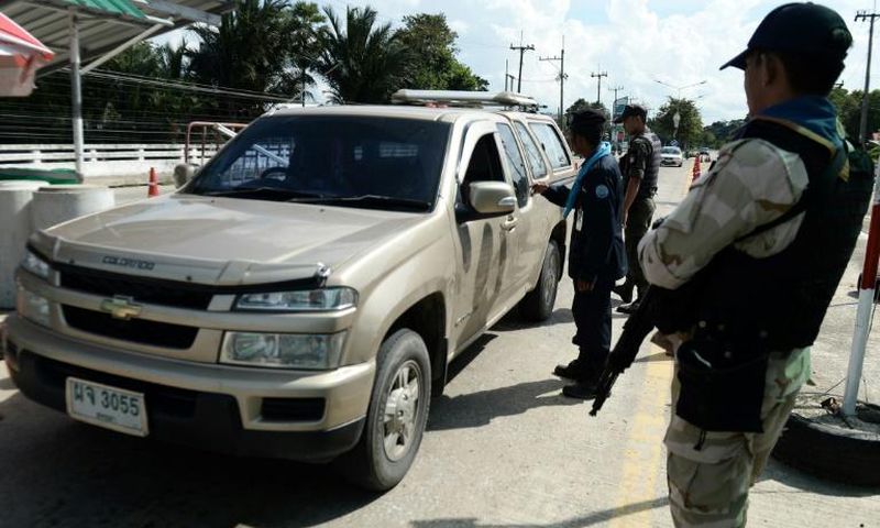 Armed civil defence volunteers and police have been searching vehicles at checkpoints in the southern province of Narathiwat