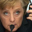 German Chancellor Angela Merkel says if the Berlin hadn't fallen, she would have driving around the US listening to Bruce Springsteen