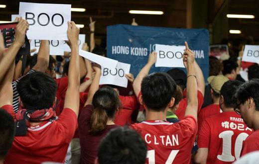 Hong Kong fans turned their backs and booed when the Chinese national anthem was played