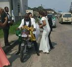 Newly weds spotted on a motorbike