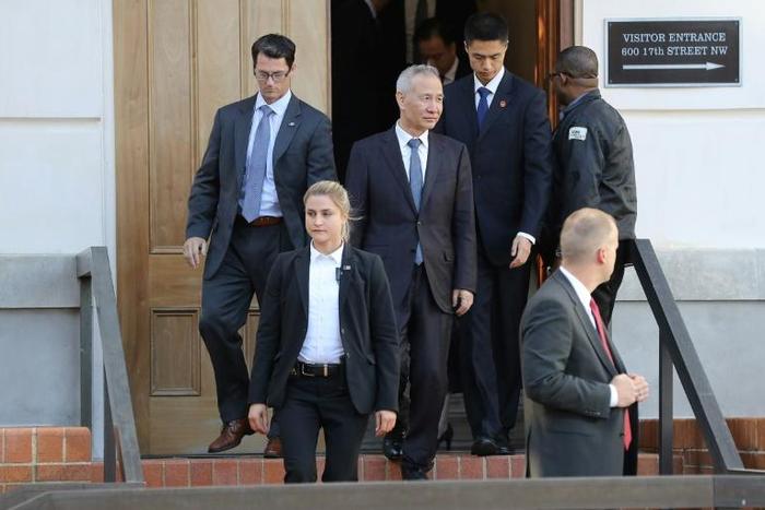 Chinese Vice Premier Liu He (C) said an 'important foundation' has been laid for a partial trade agreement with the US