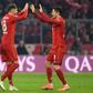 Bayern Munich's Polish striker Robert Lewandowski (R) celebrates with team-mate Leon Goretzka during the rout of Dortmund on Saturday.