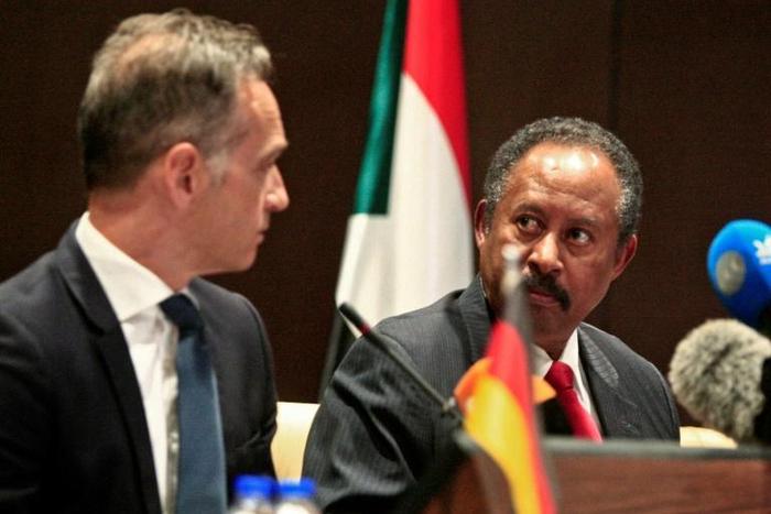 German Foreign Minister Heiko Maas (L) and Sudan's Prime Minister Abdallah Hamdok give a joint press conference in the Sudanese capital Khartoum on Tuesday