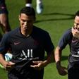 Neymar (R) jokes with PSG teammate Thiago Silva at a training session on Thursday