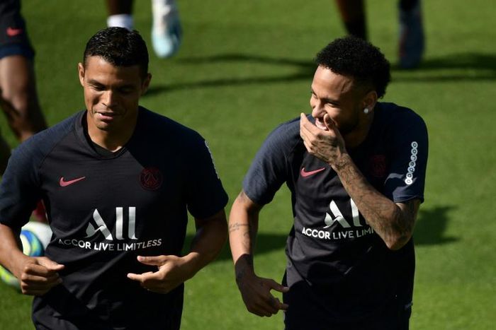 Neymar (R) jokes with PSG teammate Thiago Silva at a training session on Thursday