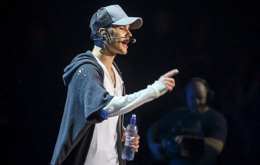 Singer Justin Bieber stands on stage during a concert in Oslo October 29, 2015
