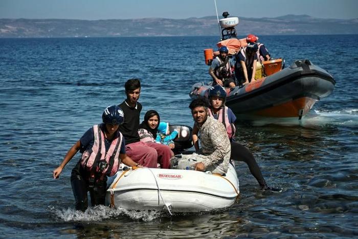Migrants helped by rescuers arrive on the Greek island of Lesbos after crossing the Aegean Sea from Turkey, on September 16, 2019