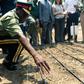A senior army representative sowing some of the first industrial hemp crop in Zimbabwe at the Harare Central Prison in the capital, on October 11, 2019.The Zimbabwe Industrial Hemp Trust (ZIHT) is the first organization to be issued with a cannabis lic...