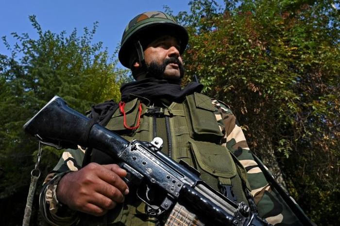 A soldier stands guard near Raj Bhavan, the official governor's residence, ahead of the swearing-in ceremony of first lieutenant governor of Jammu and Kashmir union territory, in Srinagar