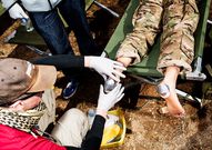 <strong>FIELD HOSPITAL:</strong> Marchers use the medical tents along the course for shade as much as for first aid. The most prevelant condition among marchers: blisters.