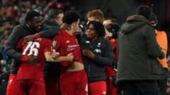 Liverpool players celebrate their penalty shootout victory over Arsenal to reach the League Cup quarter-finals