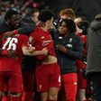 Liverpool players celebrate their penalty shootout victory over Arsenal to reach the League Cup quarter-finals