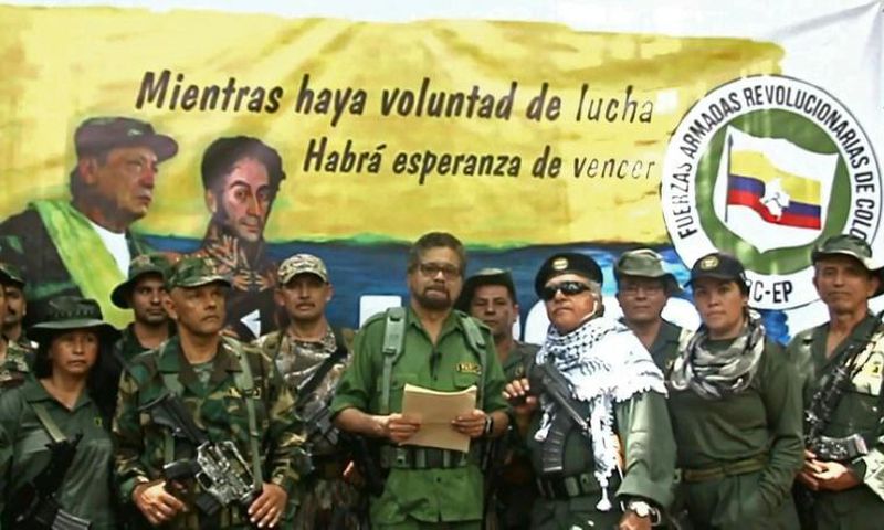 Former senior commander Ivan Marquez (center) and fugitive rebel colleague Jesus Santrich (in sunglasses), of the dissolved FARC rebel army group in Colombia, announced that they are taking up arms again along with other guerrillas