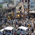Earth movers clear debris at the site of the explosion in Petlawad, Madhya Pradesh state.
