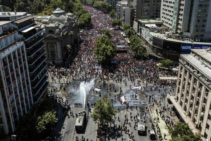Mass protests in Santiago, Chile raised questions about an upcoming Asia Pacific Economic Cooperation Summit, but the government says it will be held on schedule November 16-17