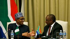 Handshake: Buhari, left, and Ramaphosa