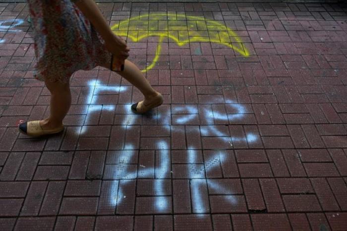 Graffiti scars the walls, pavements and shop shutters of large swathes of Hong Kong