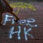 Graffiti scars the walls, pavements and shop shutters of large swathes of Hong Kong