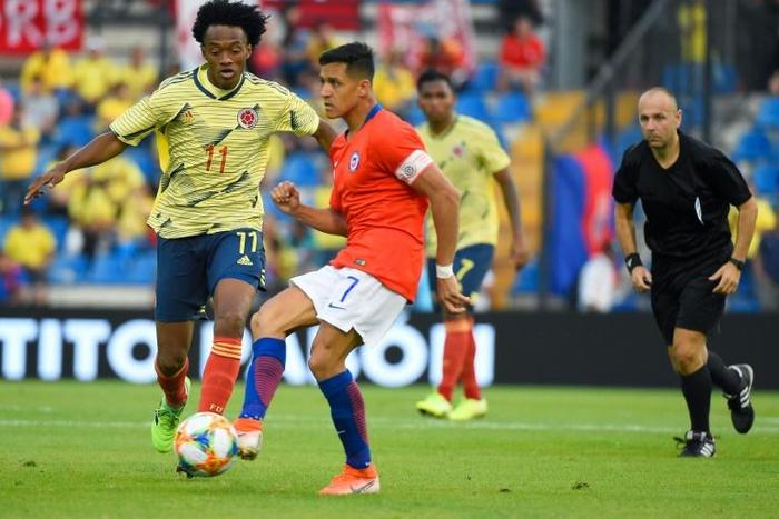 Alexis Sanchez captained Chile against Colombia until he injured an ankle